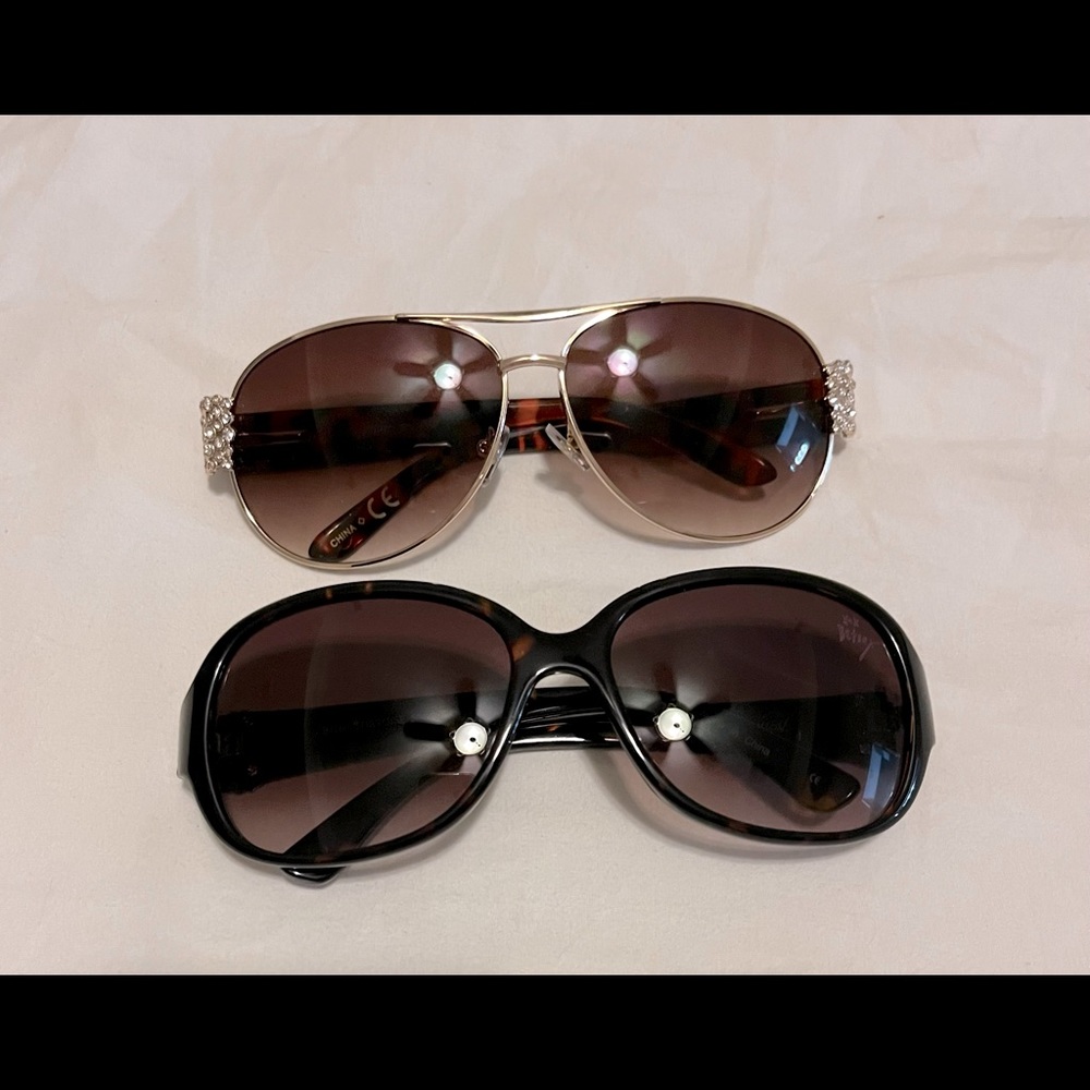 Two pair of Betsey Johnson sunglasses.